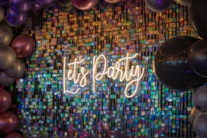 " Lets Party banner" Decorated with lights and ballons